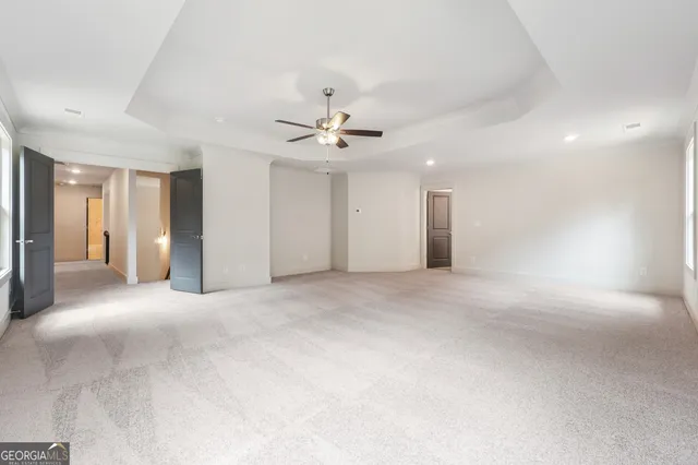 a view of a livingroom with a ceiling fan