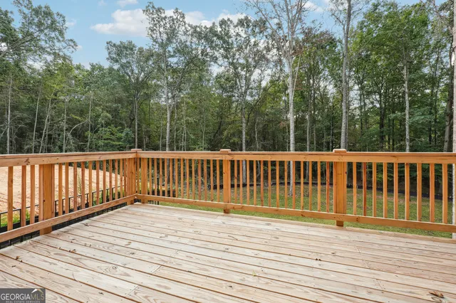a view of outdoor space with deck and yard