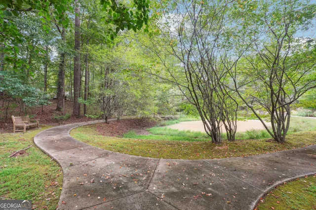 a view of a backyard with swimming pool
