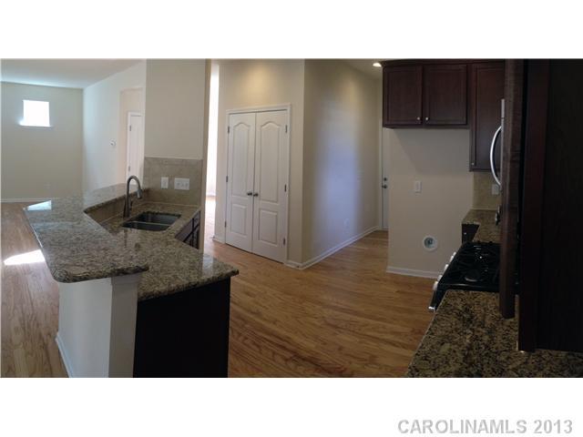 78062 Rillstone Drive, Unit LOT193 Lancaster, SC 29720 - Photo 4 of 15 a open kitchen with a sink and cabinets