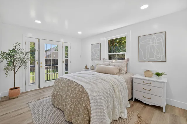 a bed room with a bed and a window