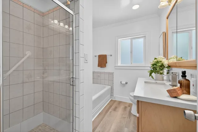 a bathroom with a sink a bathtub and a shower