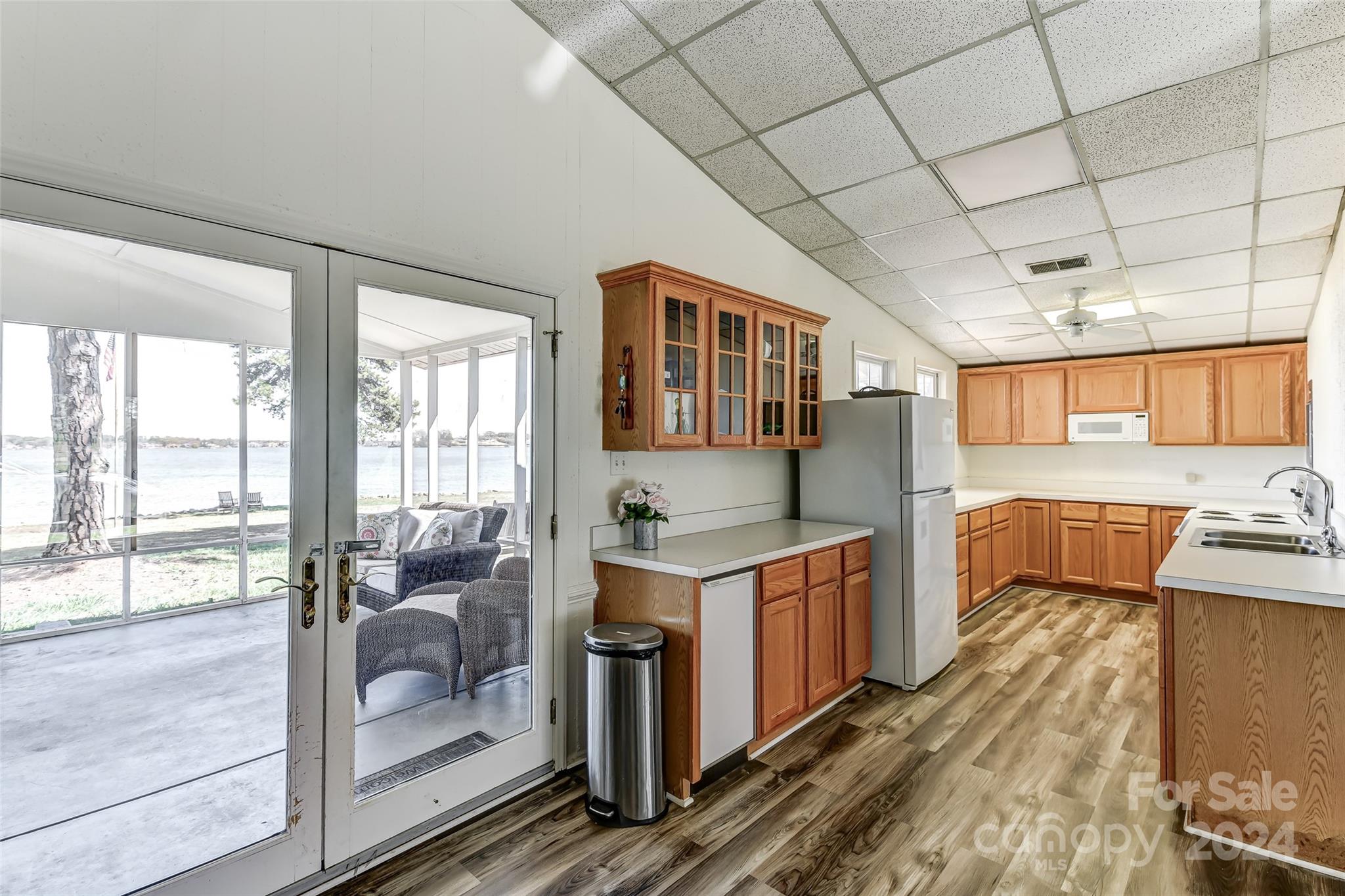 8303 Luckey Point Road Denver, NC 28037 - Photo 14 of 40 a kitchen with stainless steel appliances granite countertop a stove and a sink