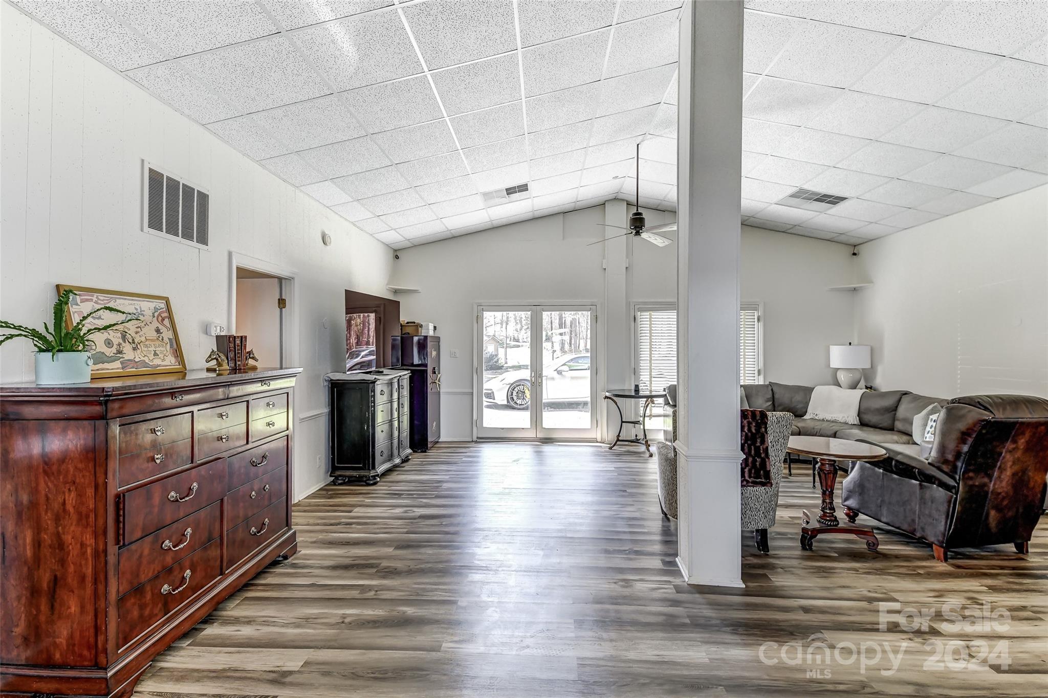 8303 Luckey Point Road Denver, NC 28037 - Photo 15 of 40 a kitchen with stainless steel appliances wooden floor and a refrigerator