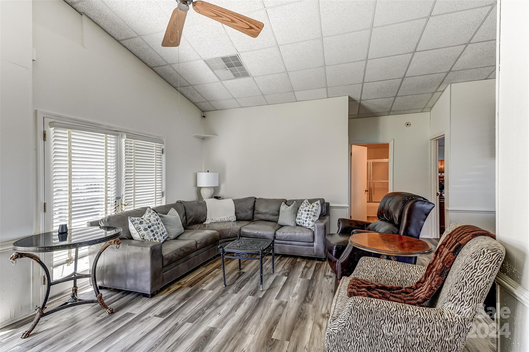 8303 Luckey Point Road Denver, NC 28037 - Photo 16 of 40 a living room with furniture and a large window