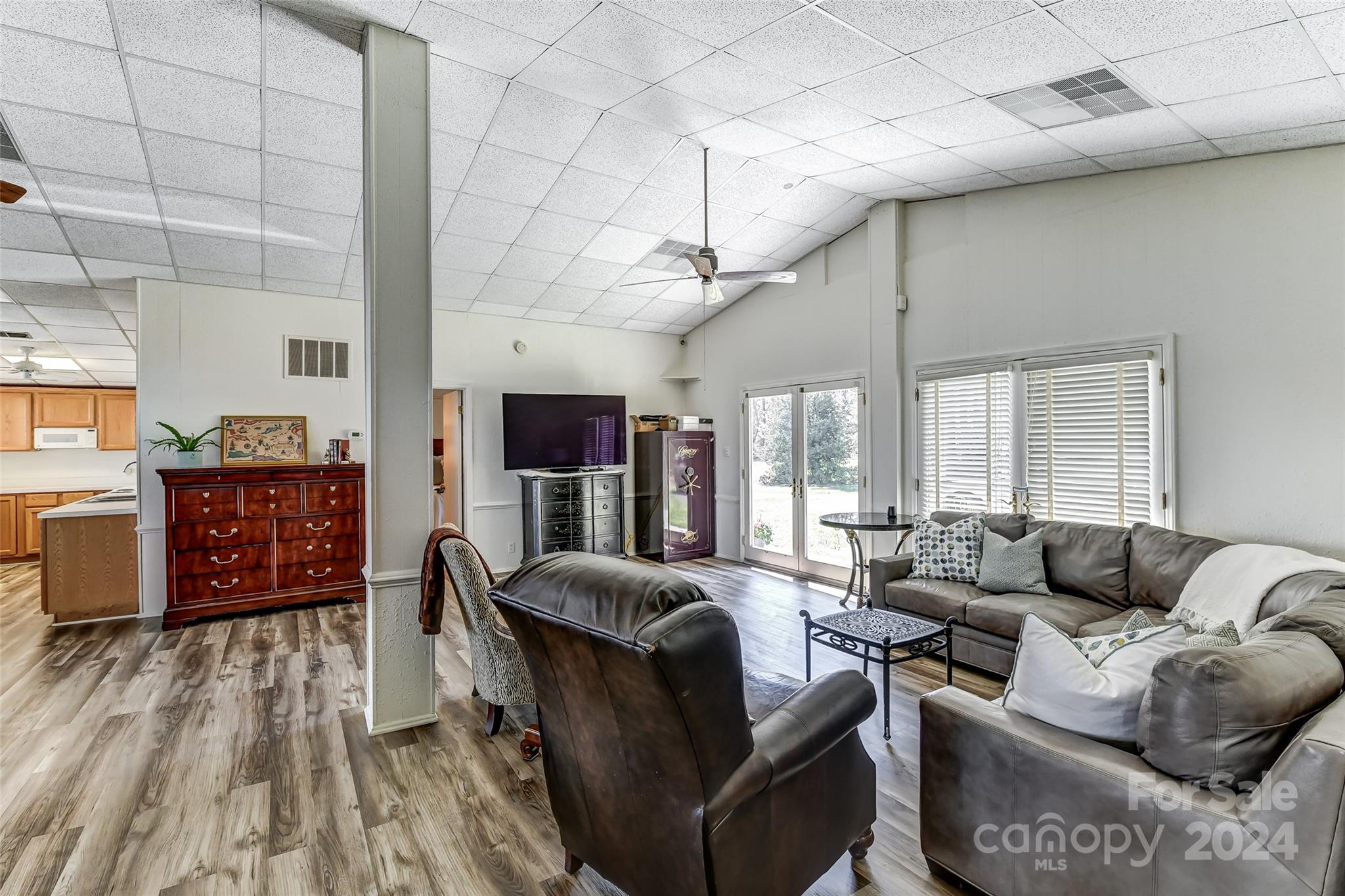 8303 Luckey Point Road Denver, NC 28037 - Photo 17 of 40 a living room with furniture and a wooden floor