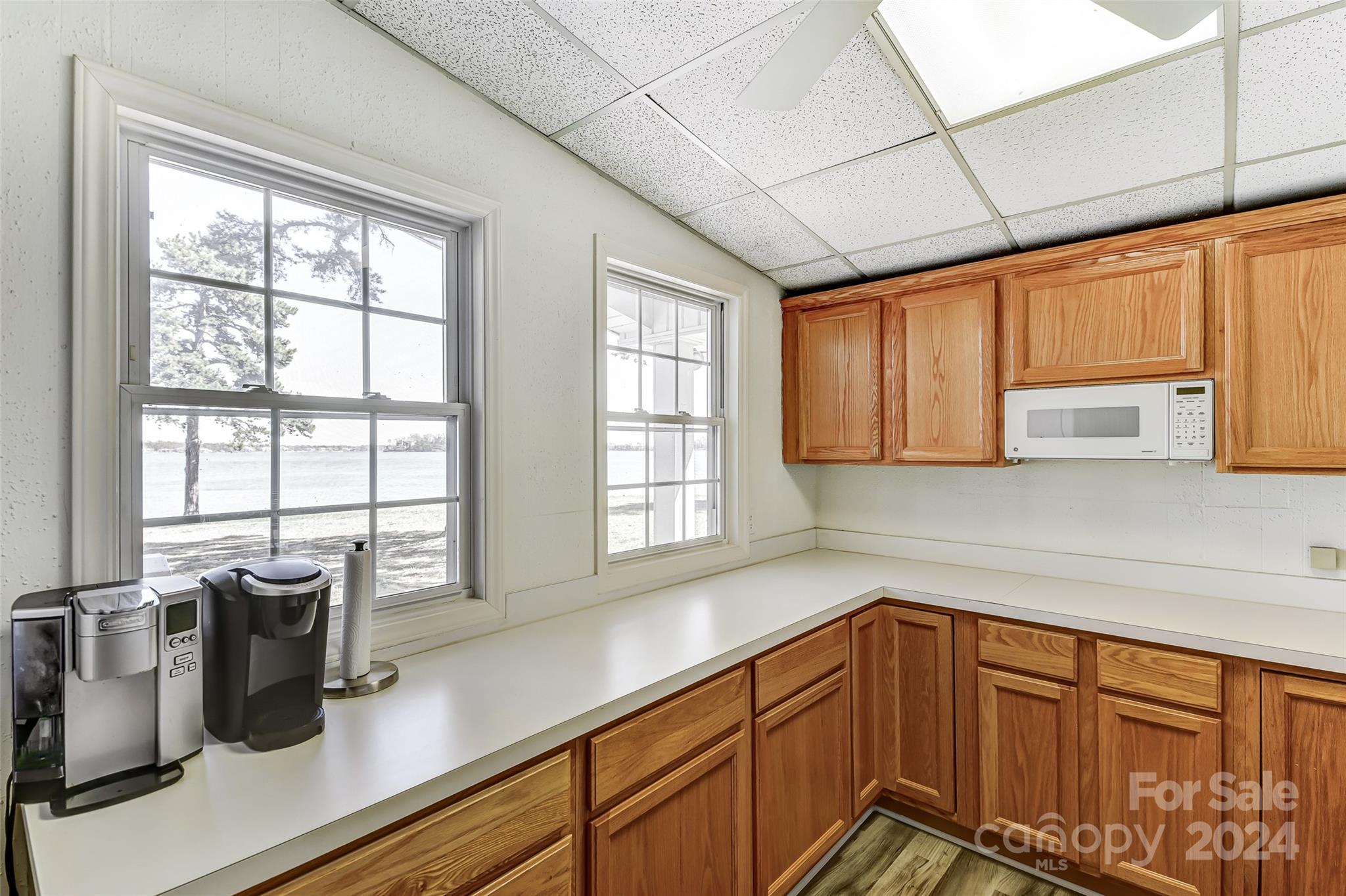 8303 Luckey Point Road Denver, NC 28037 - Photo 18 of 40 a kitchen with sink a window and cabinets