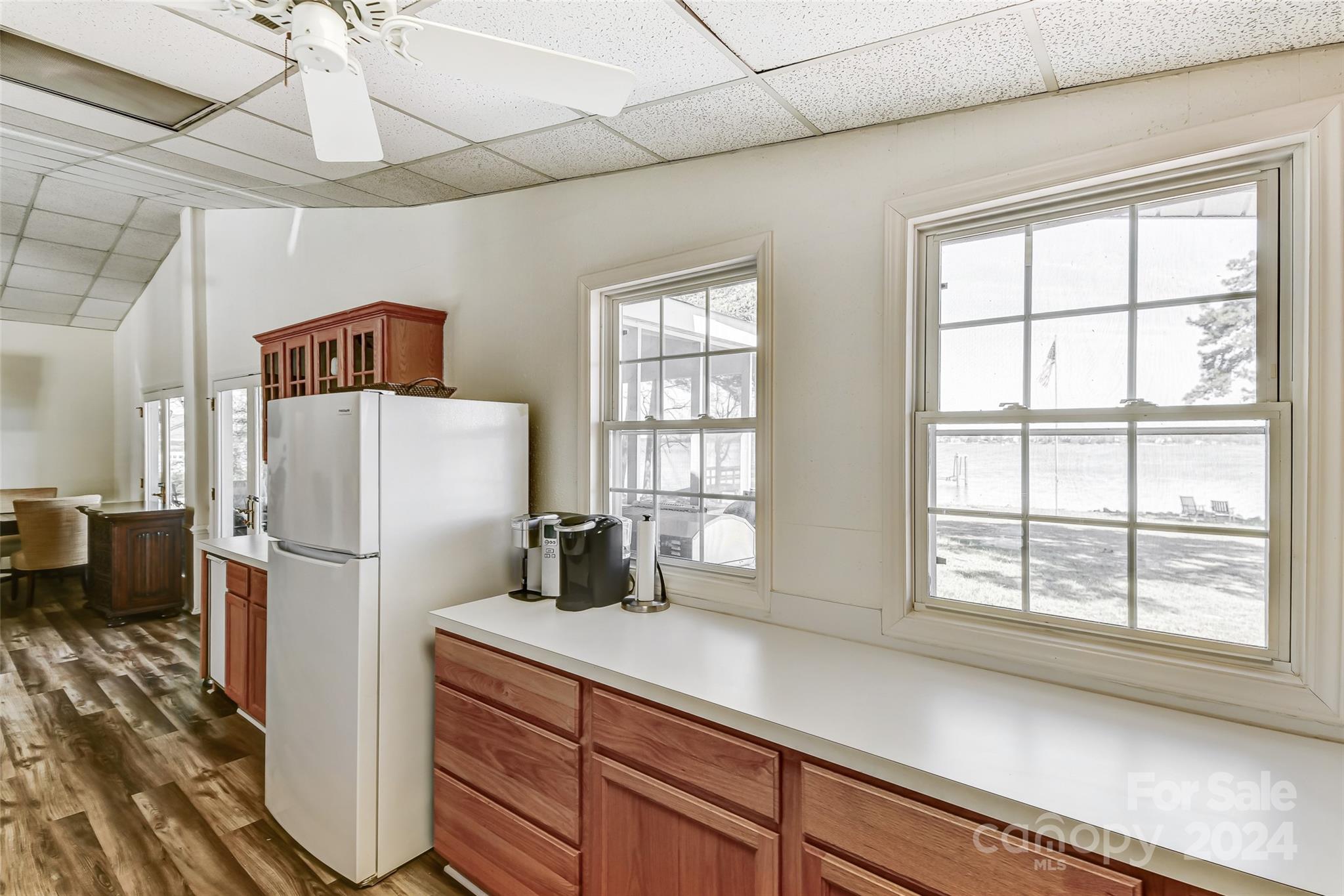 8303 Luckey Point Road Denver, NC 28037 - Photo 19 of 40 a kitchen with a refrigerator a sink and cabinets