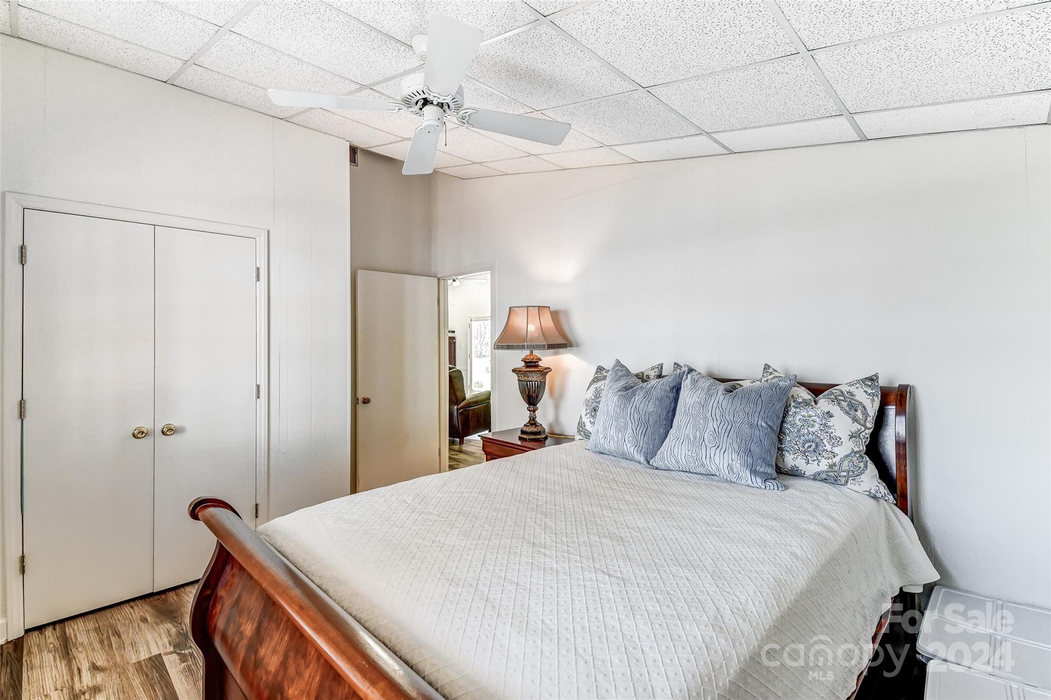8303 Luckey Point Road Denver, NC 28037 - Photo 22 of 40 a bedroom with a bed and wooden floor