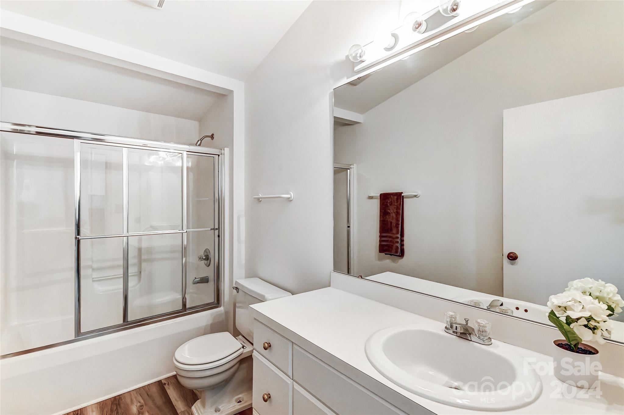 8303 Luckey Point Road Denver, NC 28037 - Photo 23 of 40 a bathroom with a sink toilet and shower