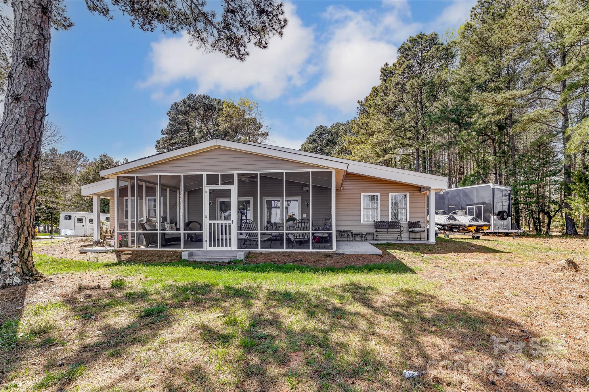8303 Luckey Point Road Denver, NC 28037 - Photo 24 of 40 a view of a house with a big yard and large trees