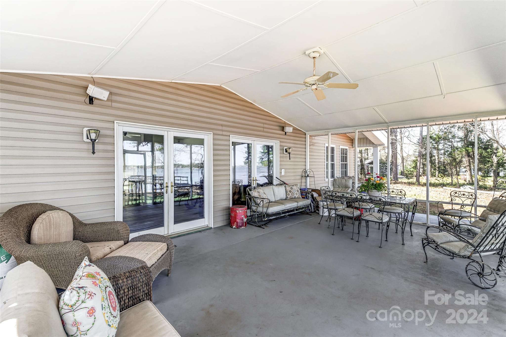 8303 Luckey Point Road Denver, NC 28037 - Photo 26 of 40 a living room with furniture and large windows