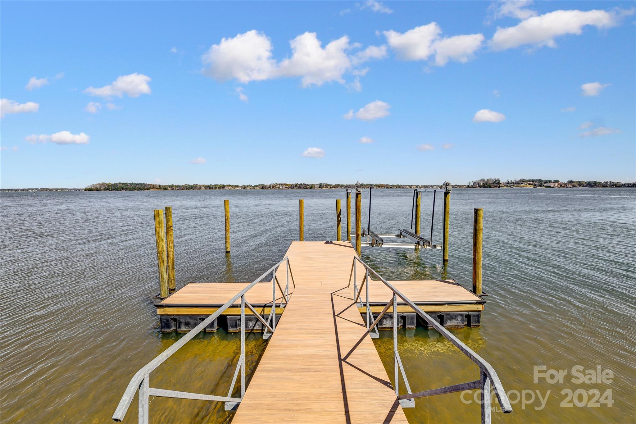 8303 Luckey Point Road Denver, NC 28037 - Photo 31 of 40 a balcony with table and chairs