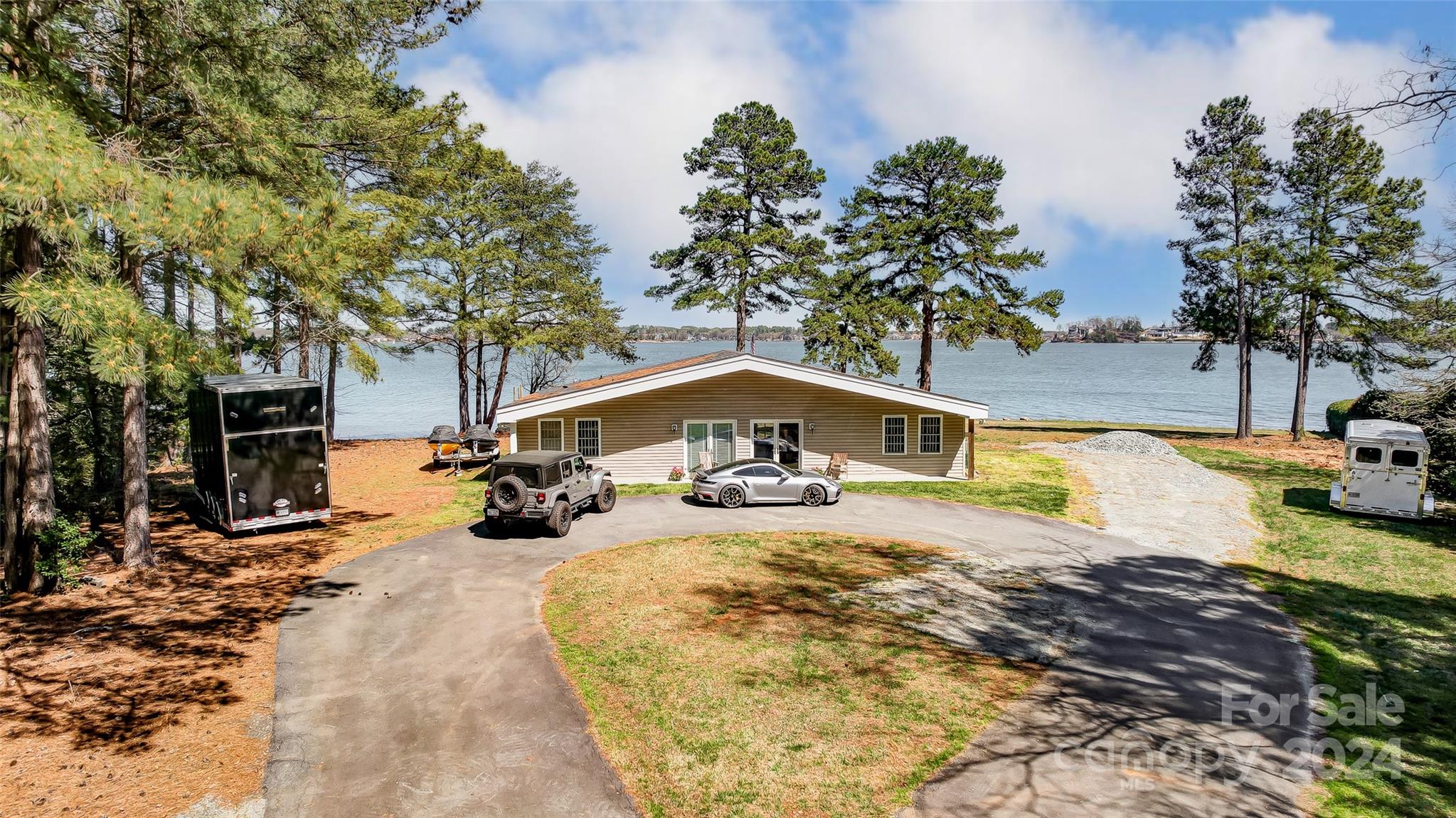 8303 Luckey Point Road Denver, NC 28037 - Photo 5 of 40 a view of a swimming pool with a patio
