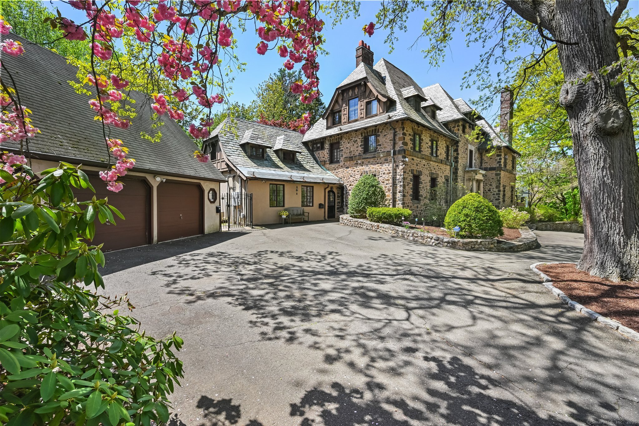 a front view of a house with garden