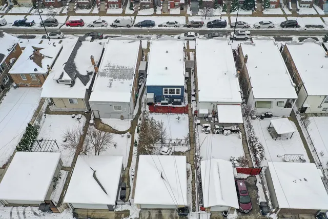 an aerial view of residential houses with outdoor space