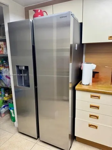 a bathroom with a shower and a mirror