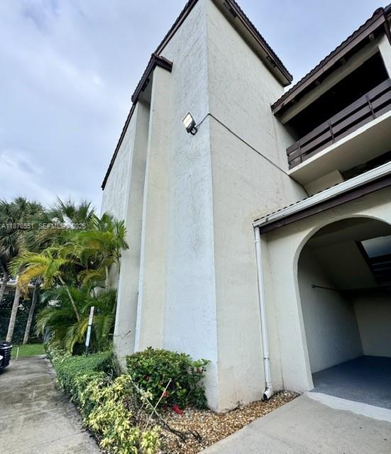 8933 Southwest 123rd Court, Unit 102 Miami, FL 33186 - Photo 2 of 19 a view of a garage