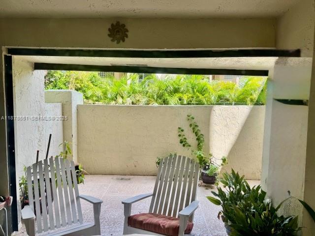 8933 Southwest 123rd Court, Unit 102 Miami, FL 33186 - Photo 8 of 19 a view of a balcony with furniture