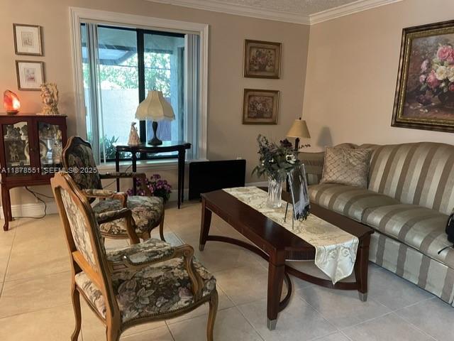 8933 Southwest 123rd Court, Unit 102 Miami, FL 33186 - Photo 9 of 19 a living room with furniture