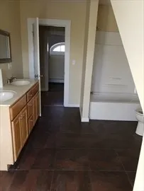 a view of a kitchen with a sink and cabinets