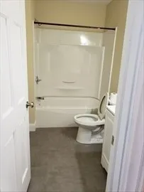 a kitchen with granite countertop a stove and a refrigerator