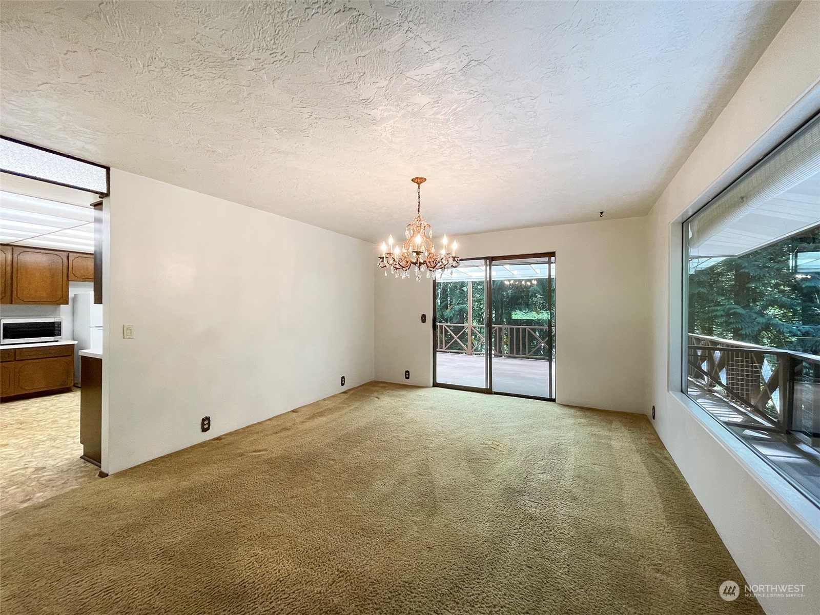 104 Waldo Road Sequim, WA 98382 - Photo 13 of 40 a view of an empty room with window and chandelier
