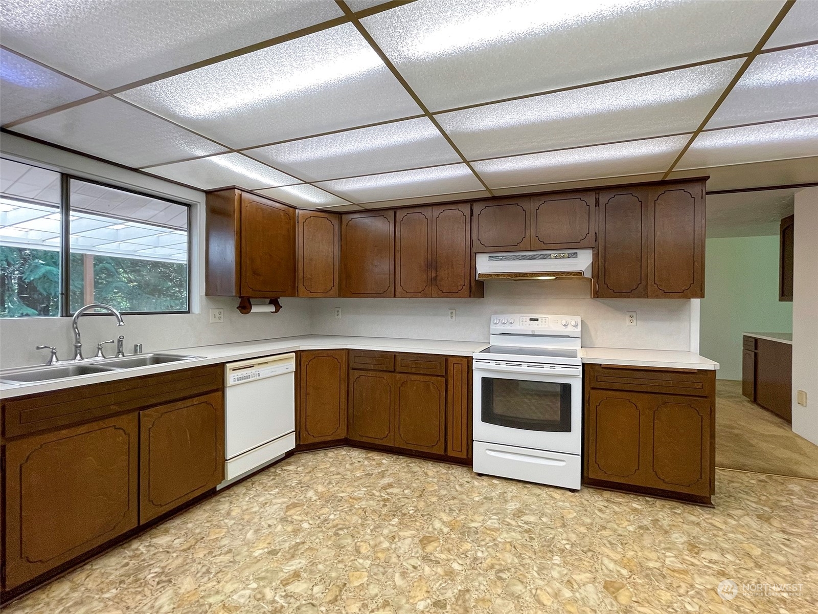 104 Waldo Road Sequim, WA 98382 - Photo 14 of 40 a kitchen with stainless steel appliances granite countertop a sink and stove top oven
