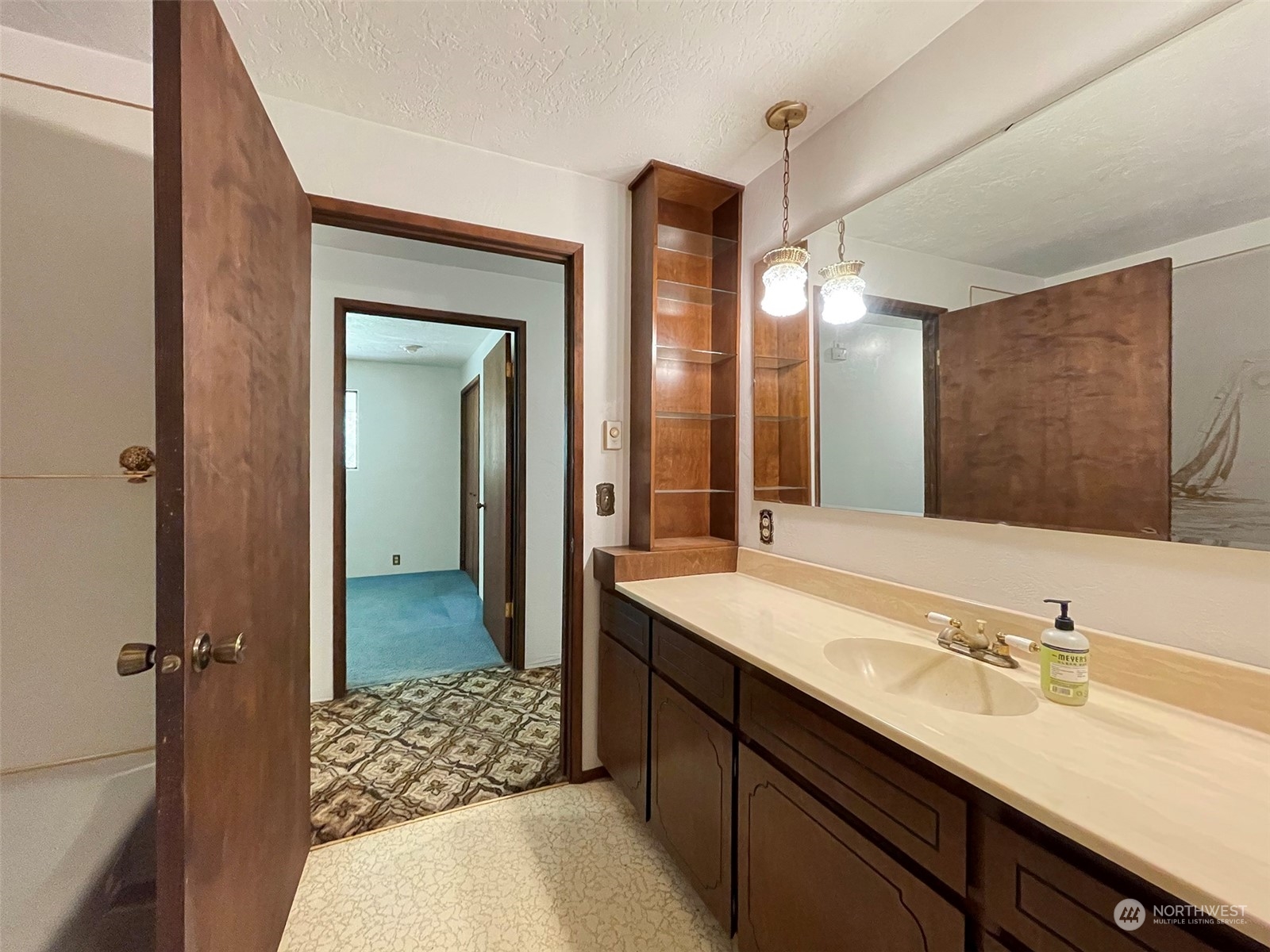 104 Waldo Road Sequim, WA 98382 - Photo 20 of 40 a bathroom with a sink and a mirror