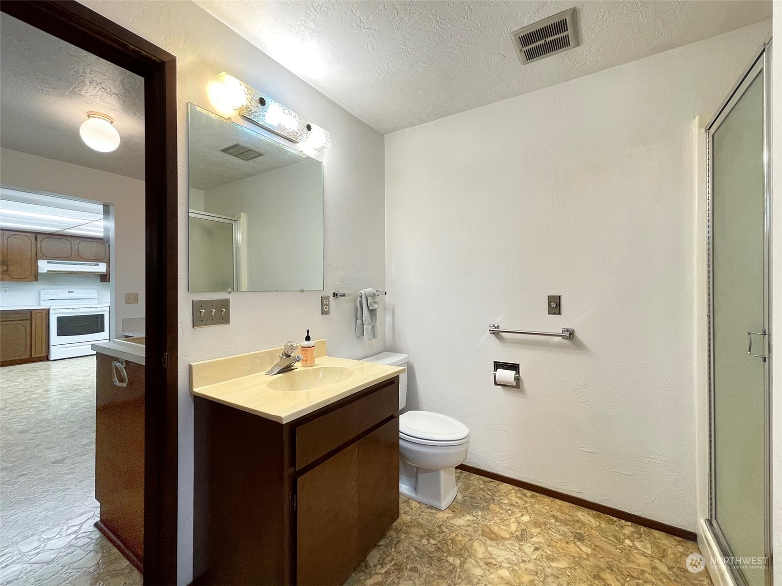 104 Waldo Road Sequim, WA 98382 - Photo 26 of 40 a bathroom with a sink and a mirror