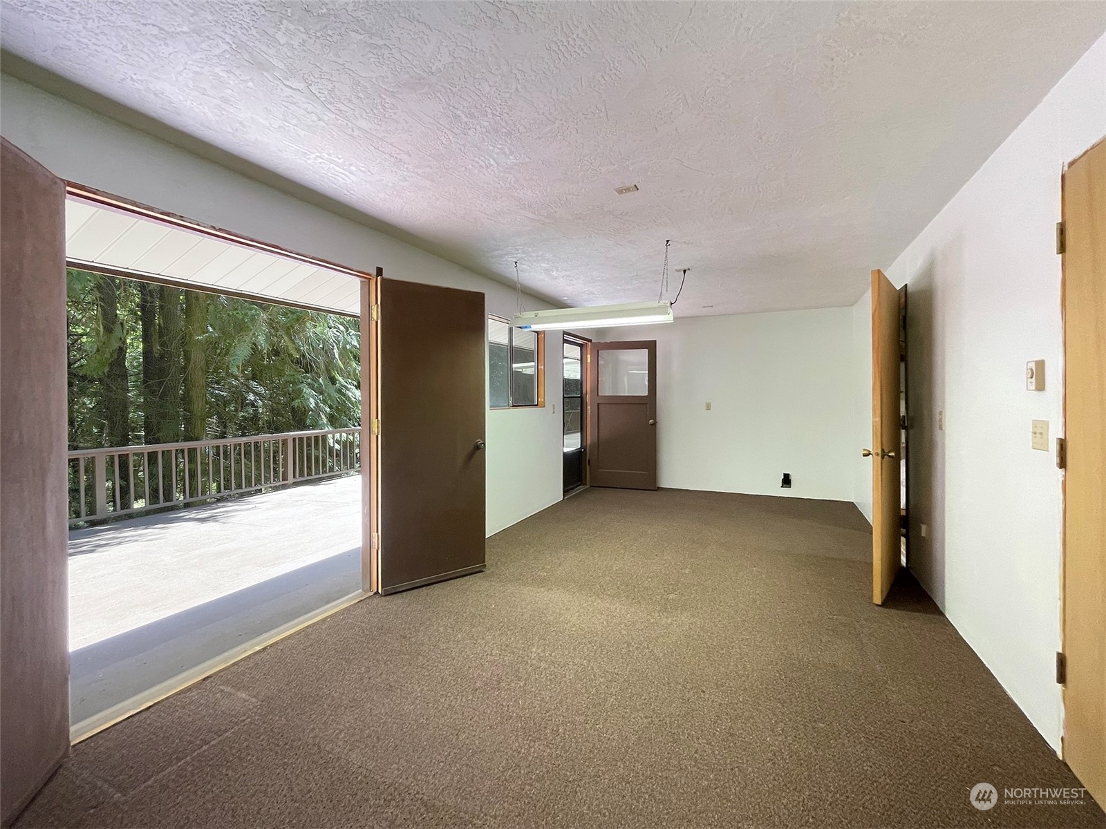 104 Waldo Road Sequim, WA 98382 - Photo 30 of 40 a view of empty room with floor to ceiling window