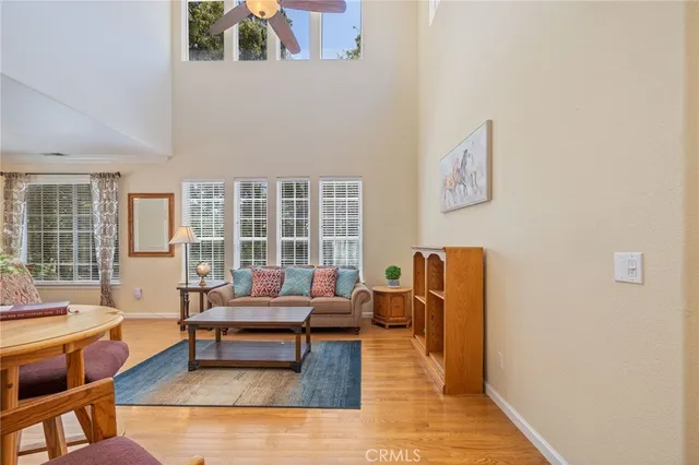 a view of a livingroom with furniture and an empty room