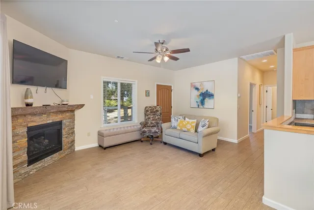 a view of a hallway with wooden floor and closet