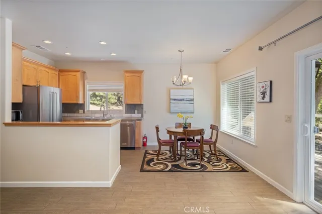 a view of a livingroom with furniture and a flat screen tv