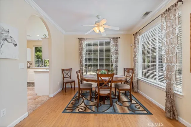 a dining room with furniture and window