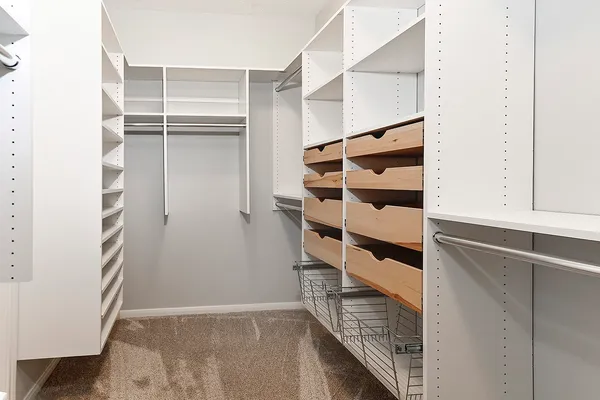 a bathroom with a sink toilet vanity and shower