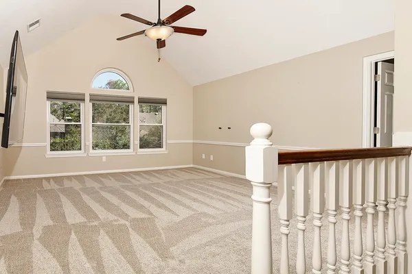 a outdoor living space with patio furniture and a rug