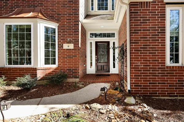a view of a room with wooden floor cabinets and a window