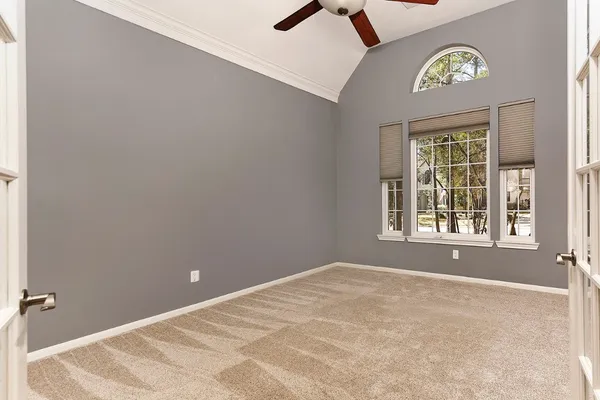 a kitchen with granite countertop a sink a counter top space appliances and cabinets