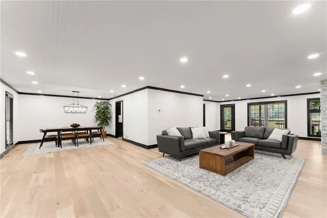 a spacious bedroom with a bed and furniture