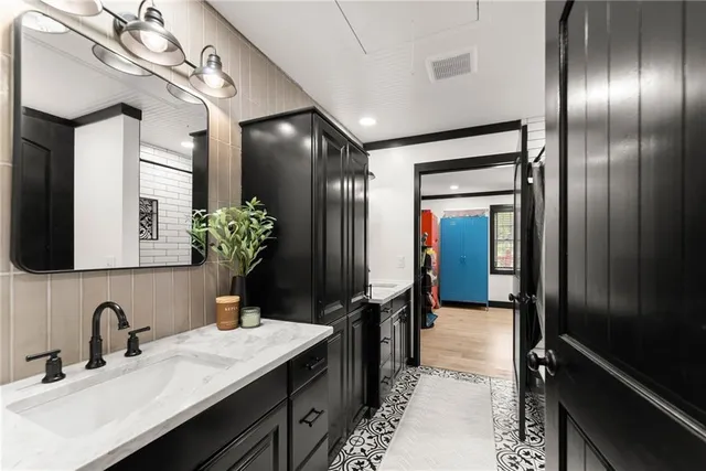 a view of a lobby with black carpet