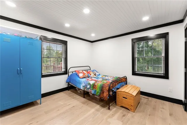 a large kitchen with stainless steel appliances granite countertop a refrigerator and a sink