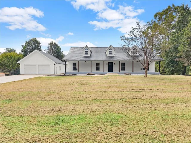 a front view of a house with a wooden fence