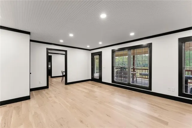 a bedroom with a large bed and dresser