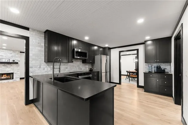 a spacious bedroom with a bed and a lamp