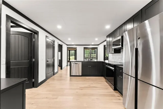 a bathroom with a double vanity sink and mirror