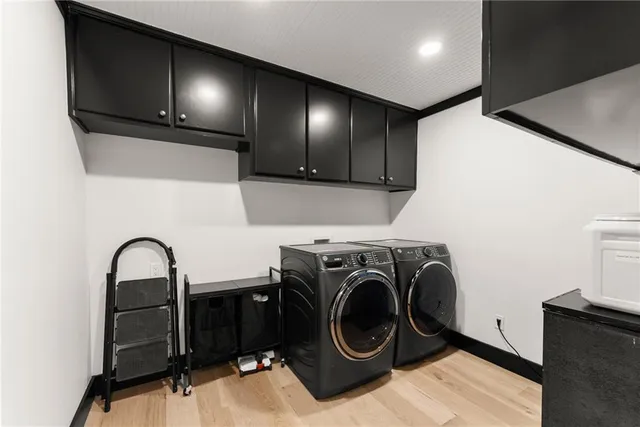 a view of walk in closet with clothes