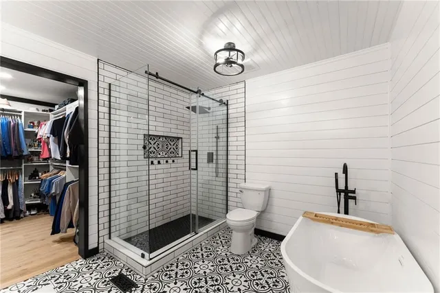 a living room with furniture and a kitchen view