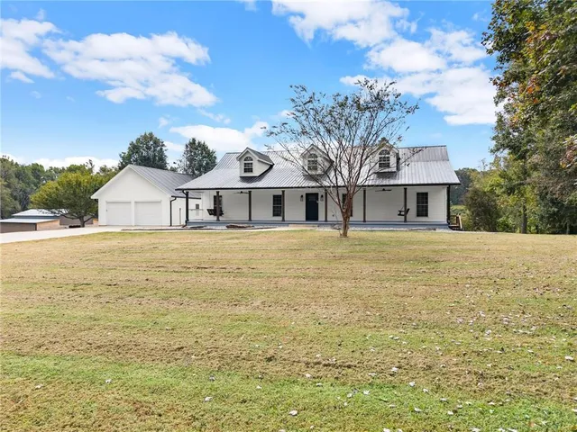 a swimming pool view with a outdoor seating