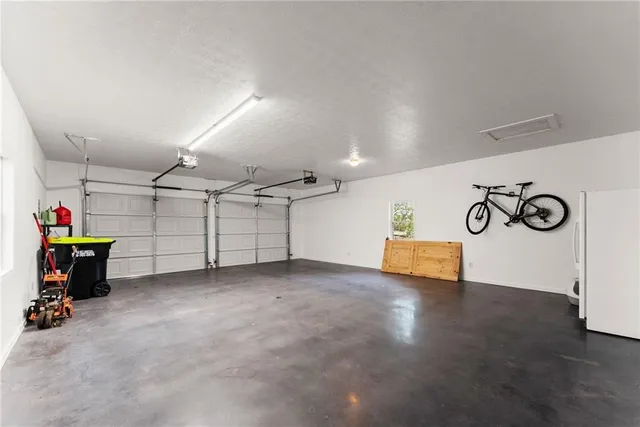 a view of a swimming pool and lounge chairs